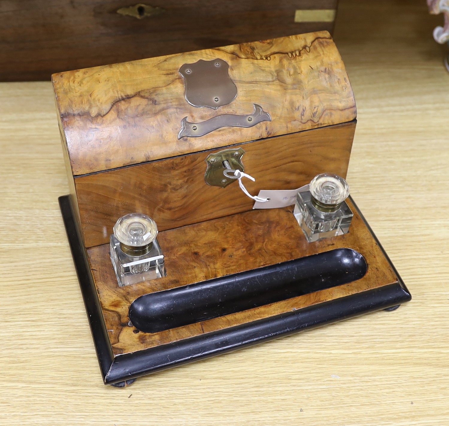 A Victorian brass bound rosewood writing slope and a Victorian walnut inkstand stationery rack, largest 50cm wide